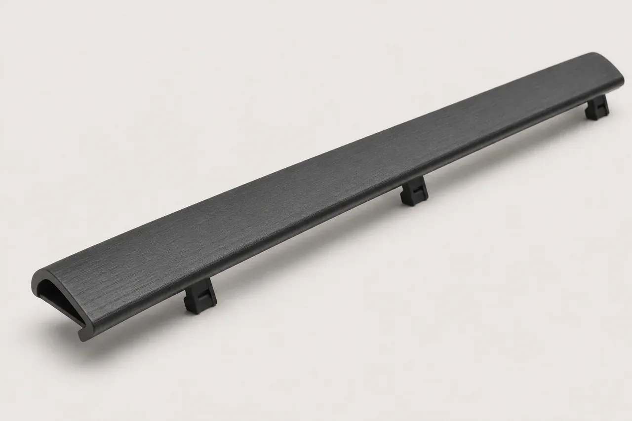 3D-printed reproduction of the rear hatch interior garnish, studio view showing the sintered nylon finish
